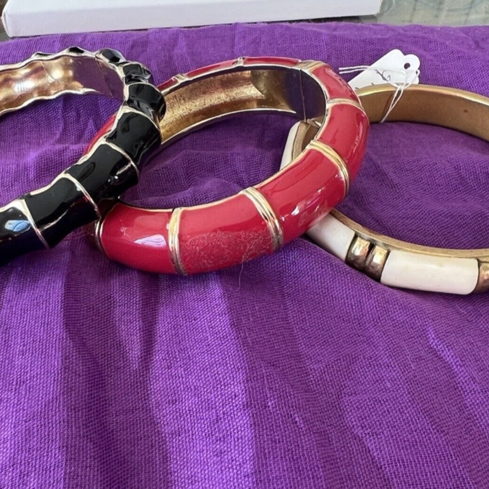 Three adjustable bracelets$ 8 Each, with magnet closure, beige, black,red.!